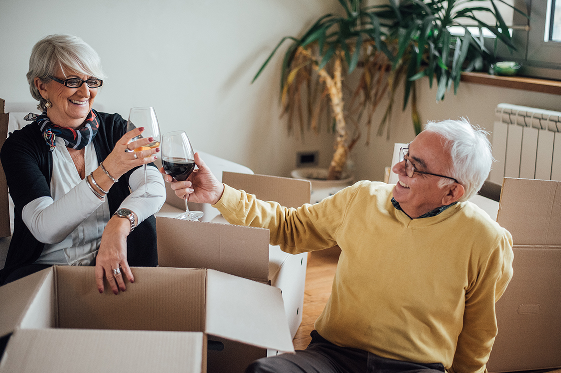Couple drinking wine in new home